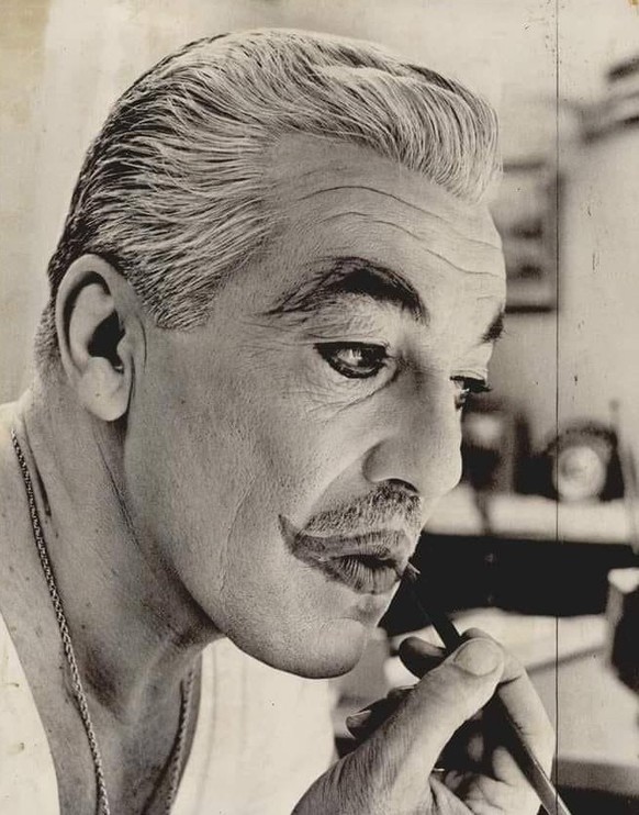 Cesar Romero applying his Joker makeup for Batman, 1967