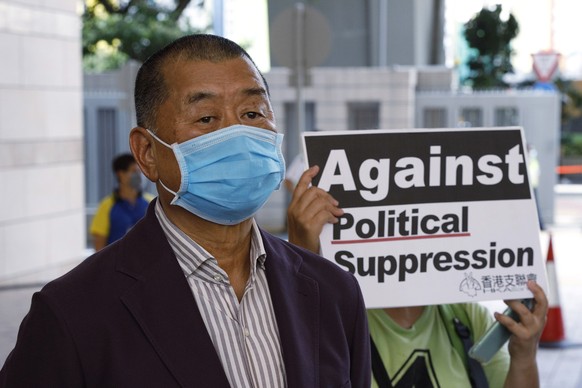 FILE - Hong Kong media mogul Jimmy Lai, founder of local newspaper Apple Daily, arrives at a district court in Hong Kong on July 30, 2020.  Lai broke into the media industry about 30 years ago armed with…