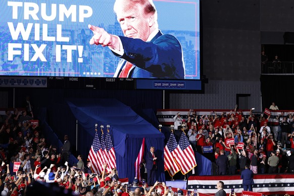 epa11701986 Republican presidential candidate and former US President Donald Trump arrives at a campaign rally in Grand Rapids, Michigan, USA, 04 November 2024. Trump and Vice President and Democratic ...