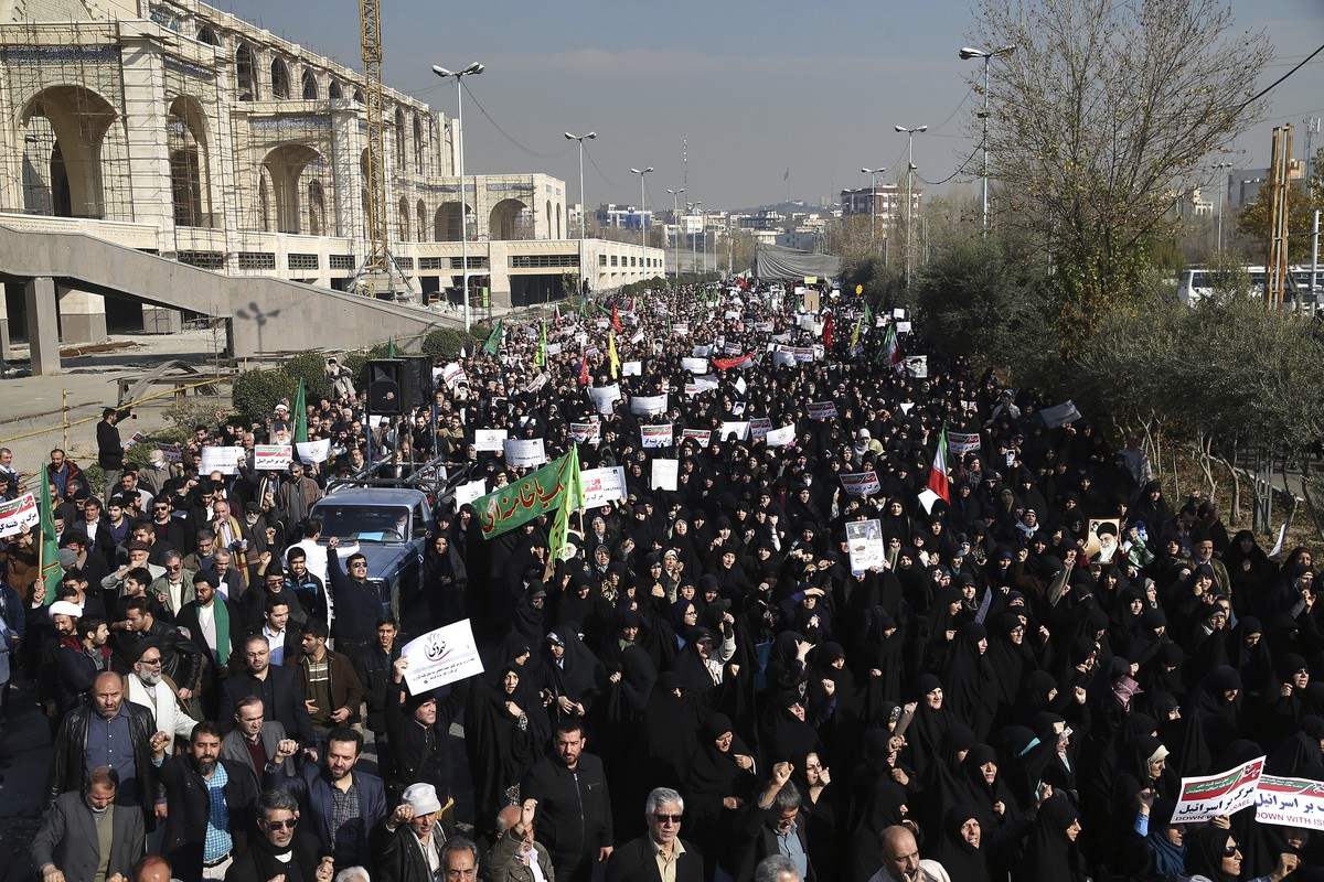 Iranian protesters chant slogans at a rally in Tehran, Iran, Saturday, Dec. 30, 2017. Iranian hard-liners rallied Saturday to support the country's supreme leader and clerically overseen governme ...