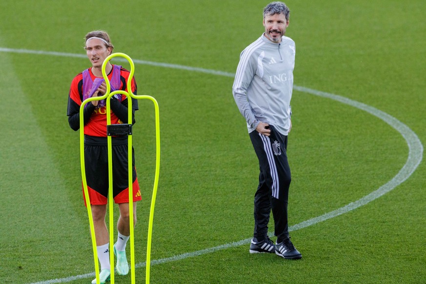 epa13254529 Belgian national soccer team head coach Mark van Bommel and his player Mika Godts (L) attend a training session in Tubize, Belgium, 21 September 2026. Belgium prepares for the upcoming UEF ...