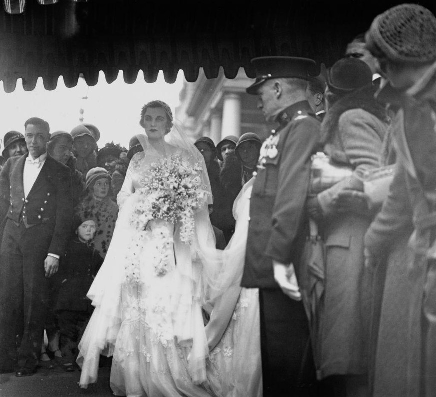 English socialite Margaret Whigham leaving her home in Princes Gate, South Kensington, London, on her way to her wedding to American amateur golfer, Charles Sweeny (1910 - 1993) at the Brompton Orator ...