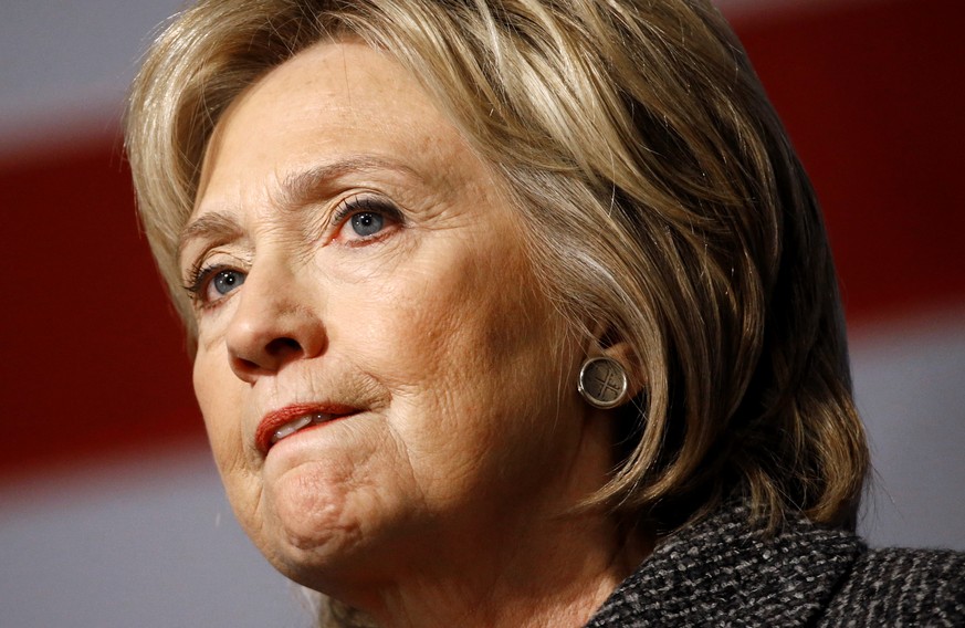 In this Jan. 12, 2016, photo, Democratic presidential candidate Hillary Clinton pauses while speaking during a campaign event at Iowa State University in Ames, Iowa. Clinton has questioned Bernie Sand ...