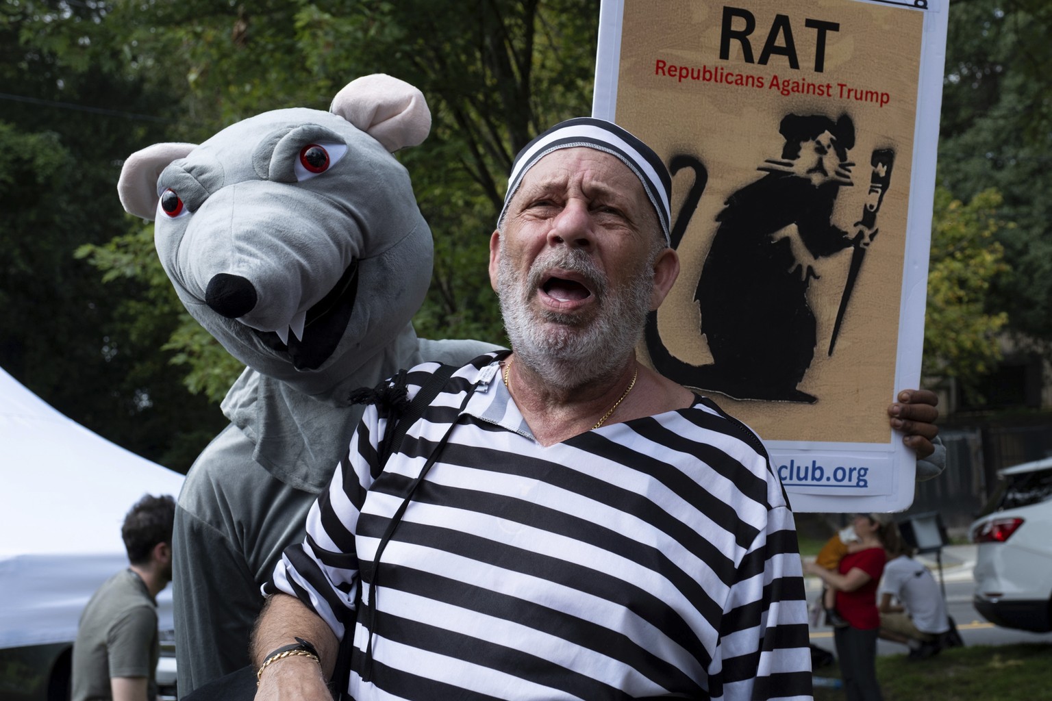 Domenic Santana, with Republicans Against Trump, talks to journalists in front of the Fulton County Jail in Atlanta on Thursday, Aug. 24, 2023. (AP Photo/Ben Gray)