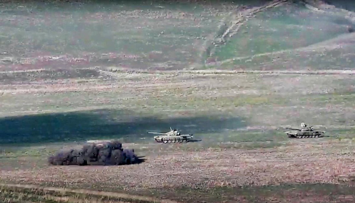 In this image taken from a footage released by Armenian Defense Ministry on Sunday, Sept. 27, 2020, Armenian army destroys Azerbaijani tanks at the contact line of the self-proclaimed Republic of Nago ...