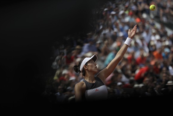 Spain&#039;s Garbine Muguruza serves the ball to France&#039;s Kristina Mladenovic during their fourth round match of the French Open tennis tournament at the Roland Garros stadium, Sunday, June 4, 20 ...