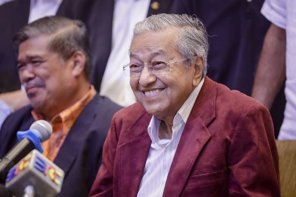 Mahathir Mohamad, center, celebrates at a hotel in Kuala Lumpur, Malaysia, Wednesday, May 9, 2018. Official results from Malaysia&#039;s national election show the opposition alliance led by the count ...