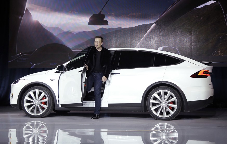 FILE - In this Sept. 29, 2015, file photo, Elon Musk, CEO of Tesla Motors Inc., introduces the Model X car at the company&#039;s headquarters in Fremont, Calif. Tesla and General Motors have a budding ...