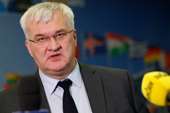 Ukraine's Foreign Minister Andrii Sybiha speaks with the media after a meeting of NATO foreign ministers at NATO headquarters in Brussels, Wednesday, Dec. 3, 2025. (AP Photo/Geert Vanden Wijngaer ...