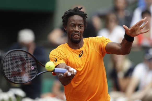 France&#039;s Gael Monfils plays a shot against Switzerland&#039;s Stan Wawrinka during their fourth round match of the French Open tennis tournament at the Roland Garros stadium, in Paris, France. Mo ...