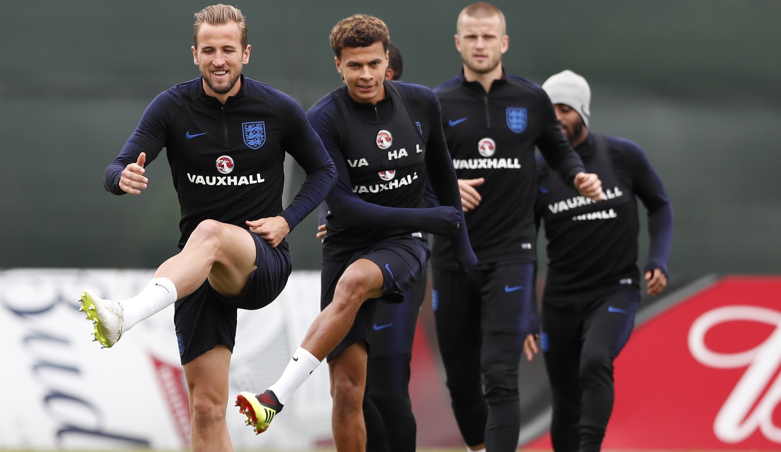 England's Harry Kane, left with England's Dele Alli, second left warm up prior to taking part in a training session for the England team at the 2018 soccer World Cup, in the Spartak Zelenogorsk ground ...