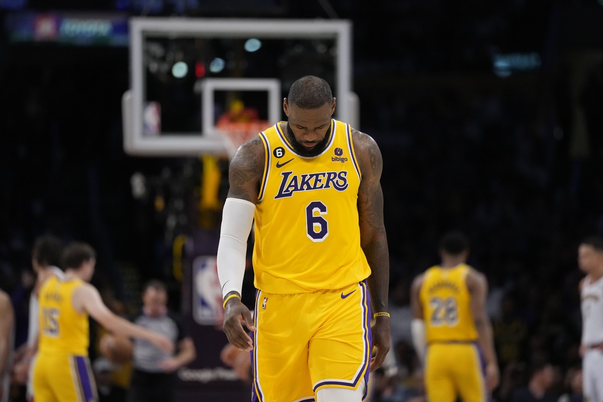 Los Angeles Lakers forward LeBron James looks down in the closing minutes of a loss to the Denver Nuggets in the second half of Game 4 of the NBA basketball Western Conference Final series Monday, May ...