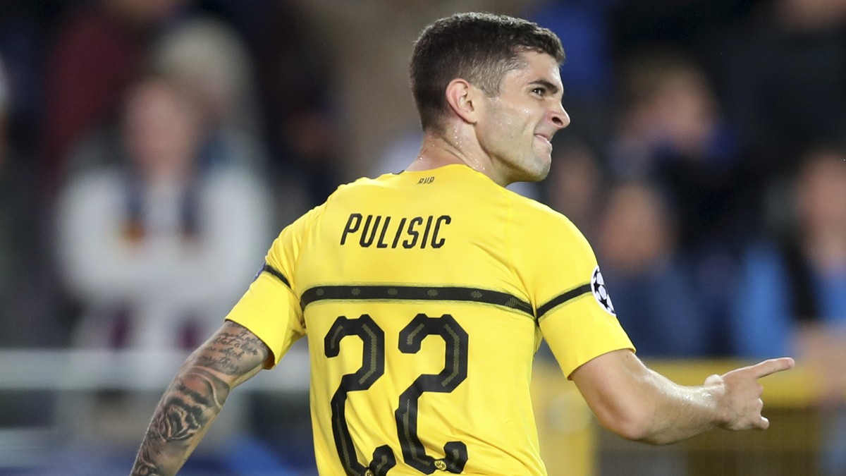 Borussia Dortmund's Christian Pulisic celebrates scoring his side's first goal during a Champions League group A soccer match between Club Brugge and Borussia Dortmund at the Jan Breydel Sta ...