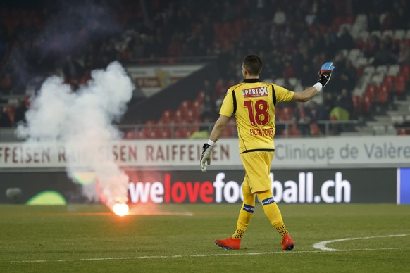 Sion&#039;s goalkeeper Kevin Fickentscher leaves the pitch after that Grasshopper&#039;s supporters launching light flares, during the Super League soccer match of Swiss Championship between FC Sion a ...