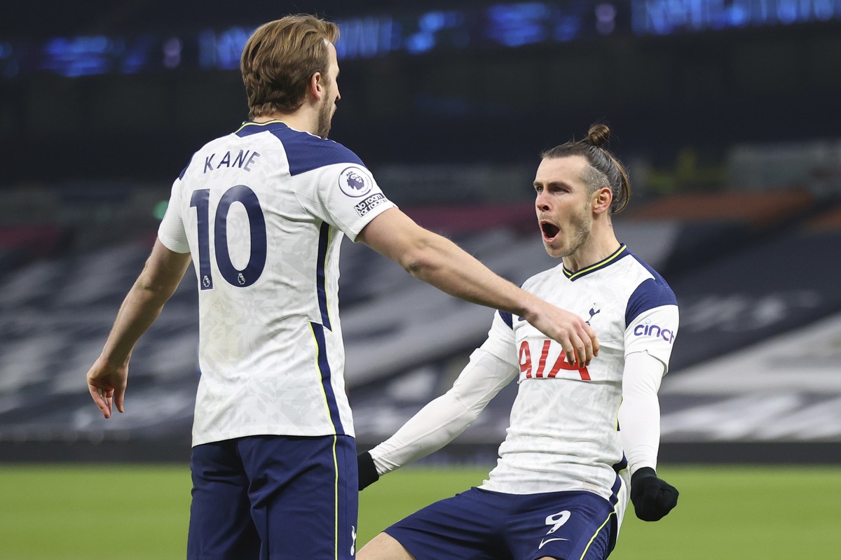 Tottenham's Gareth Bale, right, celebrates after scoring his side's second goal with Tottenham's Harry Kane during the English Premier League soccer match between Tottenham Hotspur and  ...
