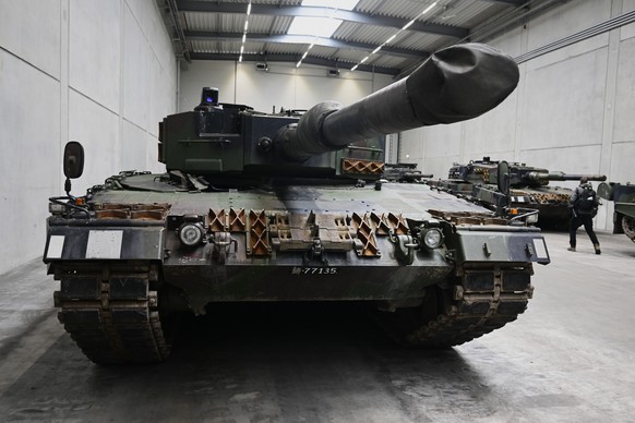 epa11147203 A view of a Leopard 2 tank at a production line as the German chancellor and defence minister visit the future site of an arms factory where weapons maker Rheinmetall plans to produce arti ...