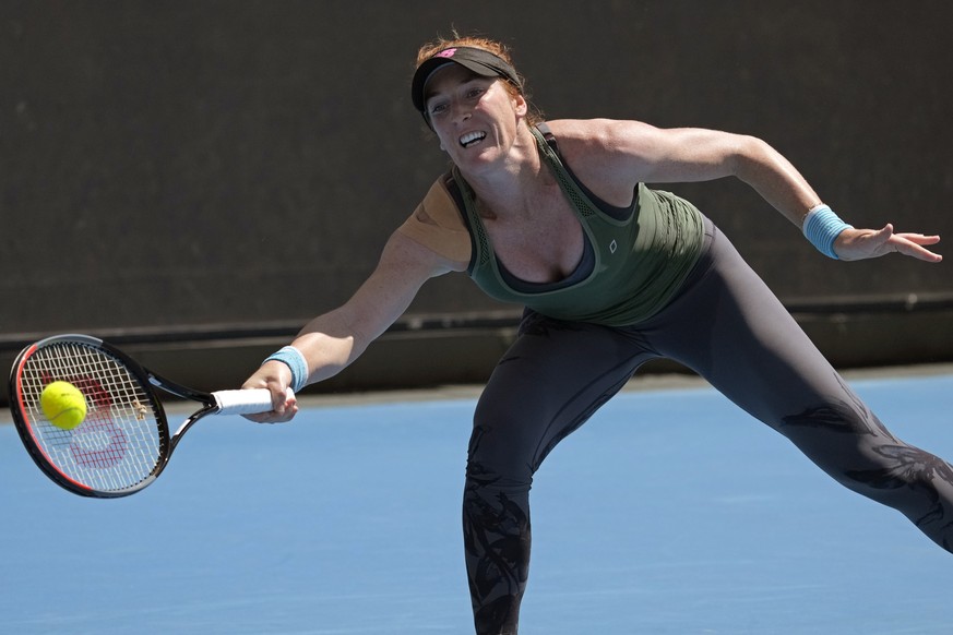 Madison Brengle of the U.S. plays a forehand return to Dayana Yastremska of Ukraine during their first round match at the Australian Open tennis championships in Melbourne, Australia, Monday, Jan. 17, ...