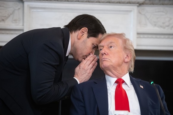 epaselect epa12440529 US Secretary of State Marco Rubio (L) whispers to President Donald Trump (R) during a Roundtable on Antifa in the State Dining Room of the White House in Washington, DC, USA, 08  ...
