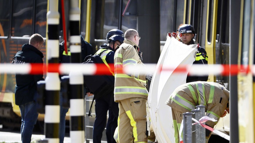 epa07446537 Emergency services and police forces at the scene where a shooting took place at the 24 Oktoberplace in Utrecht, The Netherlands, 18 March 2019. According to the the Dutch Police, several  ...