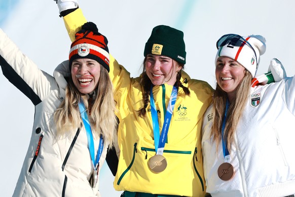 epa12734460 (from L) Silver medalist Eva Adamczykova of Czechia, gold medalist Josie Baff of Australia and bronze medalist Michela Moioli of Italy during the medal ceremony for the Women's Snowbo ...