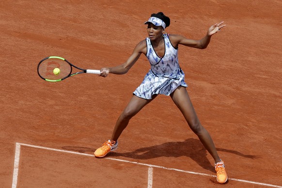 Venus Williams of the U.S. plays a shot against Timea Bacsinszky of Switzerland during their fourth round match of the French Open tennis tournament at the Roland Garros stadium, in Paris, France. Sun ...