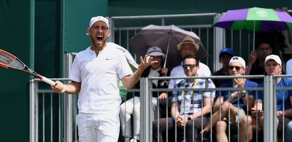 epa06069749 Dudi Sela of Israel in action against John Isner of the USA during their second round match for the Wimbledon Championships at the All England Lawn Tennis Club, in London, Britain, 06 July ...
