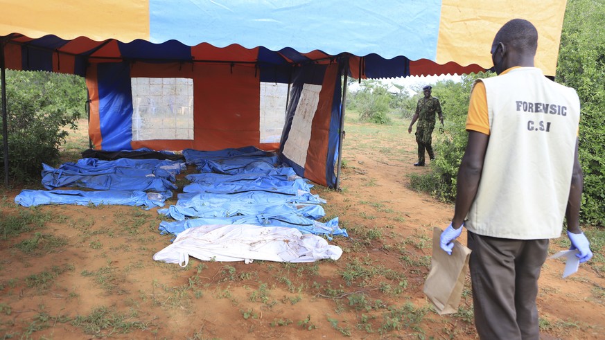 Body bags containing victims of a Christin cult are seen during the excavation in a forest on the outskirts of Shakahola in the town of Malindi, Kenyan coast, Tuesday, April 25, 2023. Kenyan President William Ruto...