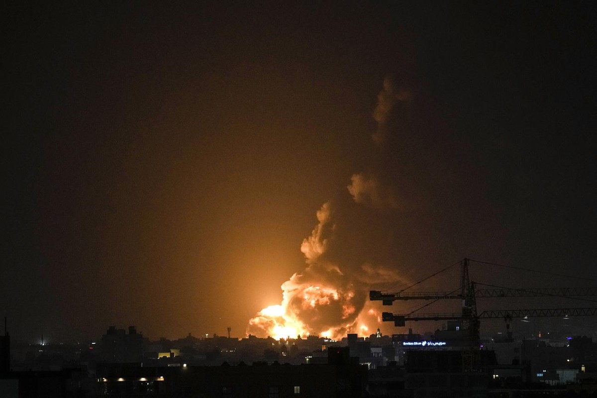 Fire form an oil depot lights the sky over Jiddah, Saudi Arabia, Friday, March 26, 2022. Yemen's Iran-backed Houthi rebels have attacked an oil depot in the Saudi city of Jiddah ahead of a Formul ...
