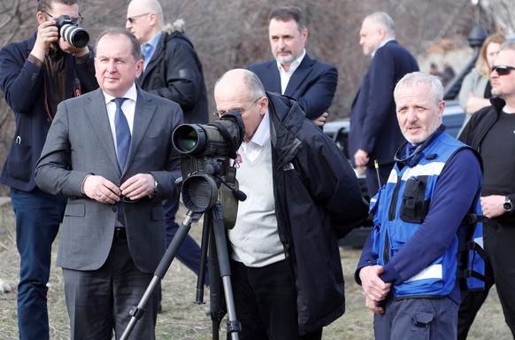 epa09860779 Polish Foreign Minister and acting OSCE Chairman-in-Office Zbigniew Rau (C) is seen near the border between the Georgian breakaway region of South Ossetia and Georgia in the village of Odz ...