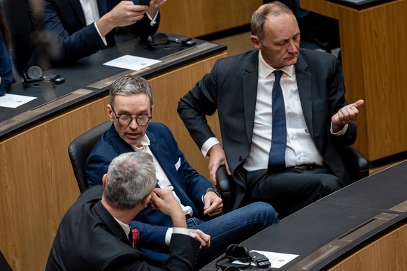 epa10550017 Leader of right-wing Austrian Freedom Party (FPOe) Herbert Kickl (2-L) and FPOe MPs Norbert Hofer (L) and Axel Kassegger (R) chat prior to a video address by Ukraine&#039;s President Volod ...