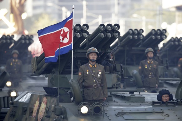 FILE - North Korean soldiers stand on armored vehicles carrying rocket launchers as they parade in Pyongyang, North Korea, on October 1.  October 10, 2015. Hamas fighters likely used North Korean-made rocket propellers...
