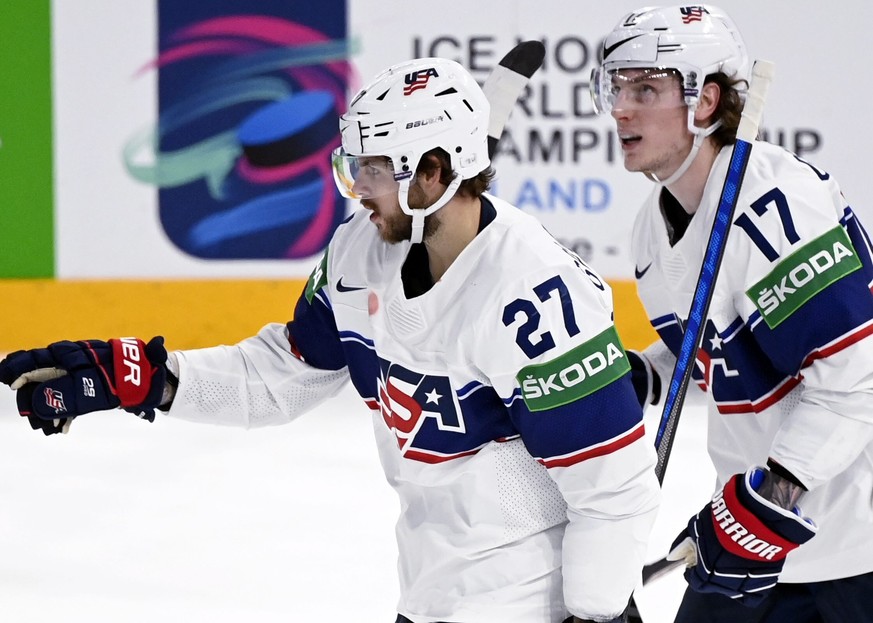 Goal scorer Alex Galchenyuk, left, and Adam Gaudette of USA celebrate during the 2022 IIHF Ice Hockey World Championships preliminary round group B match between Finland and USA in Tampere, Finland, M ...