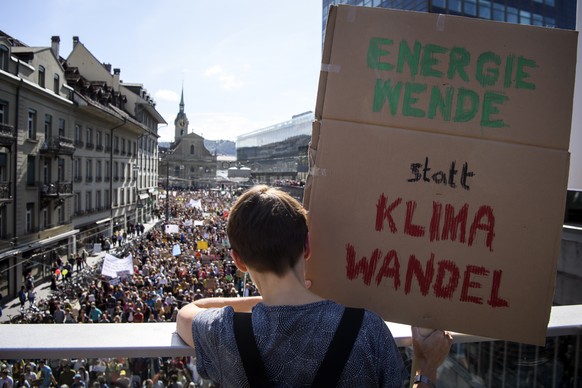 epa07876884 Thousands of people demonstrate during a &#039;National Climate strike&#039; to protest a lack of climate awareness in Bern, Switzerland, 28 September 2019. The sign reads &#039;Energy tur ...
