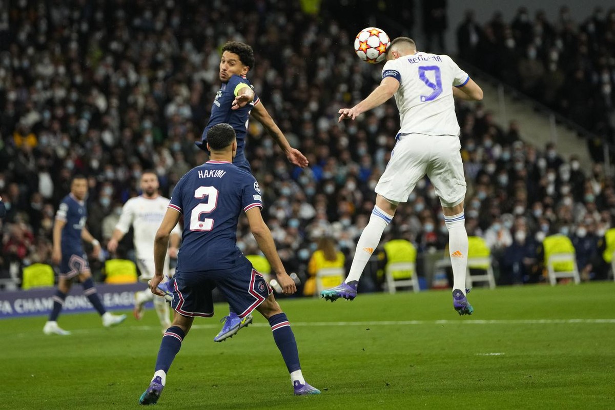 Real Madrid's Karim Benzema misses as he heads on goal during the Champions League, round of 16, second leg soccer match between Real Madrid and Paris Saint-Germain at the Santiago Bernabeu stadi ...