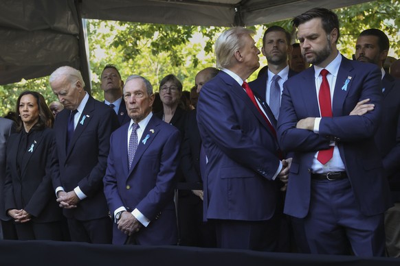 Republican presidential nominee former President Donald Trump, second from right, looks away while attending the 9/11 Memorial ceremony with Republican vice presidential nominee Sen. JD Vance, R-Ohio, ...