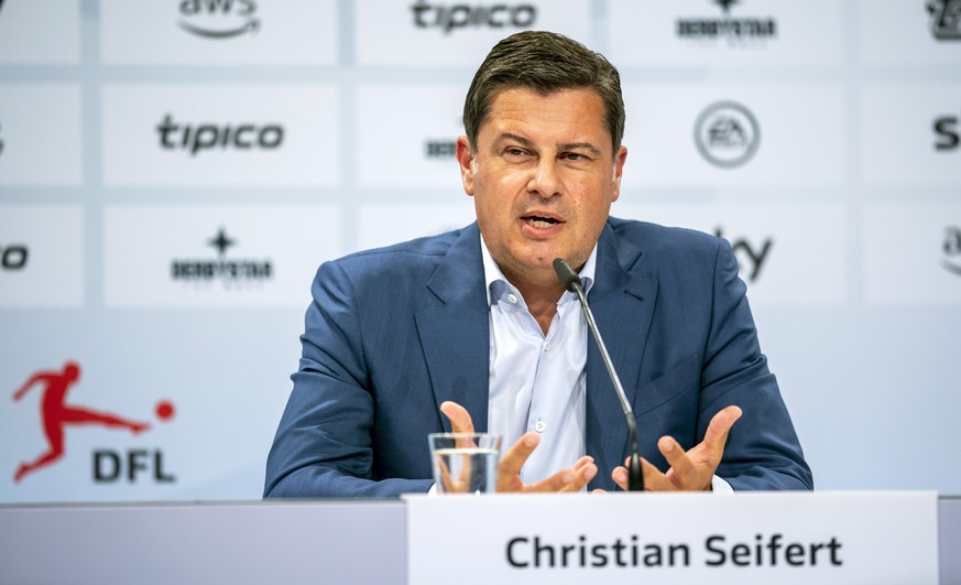 epa08583277 German Football League (DFL) chief executive Christian Seifert speaks during a press conference after a general meeting of the DFL in Frankfurt am Main, Germany, 04 August 2020. EPA/RONALD ...