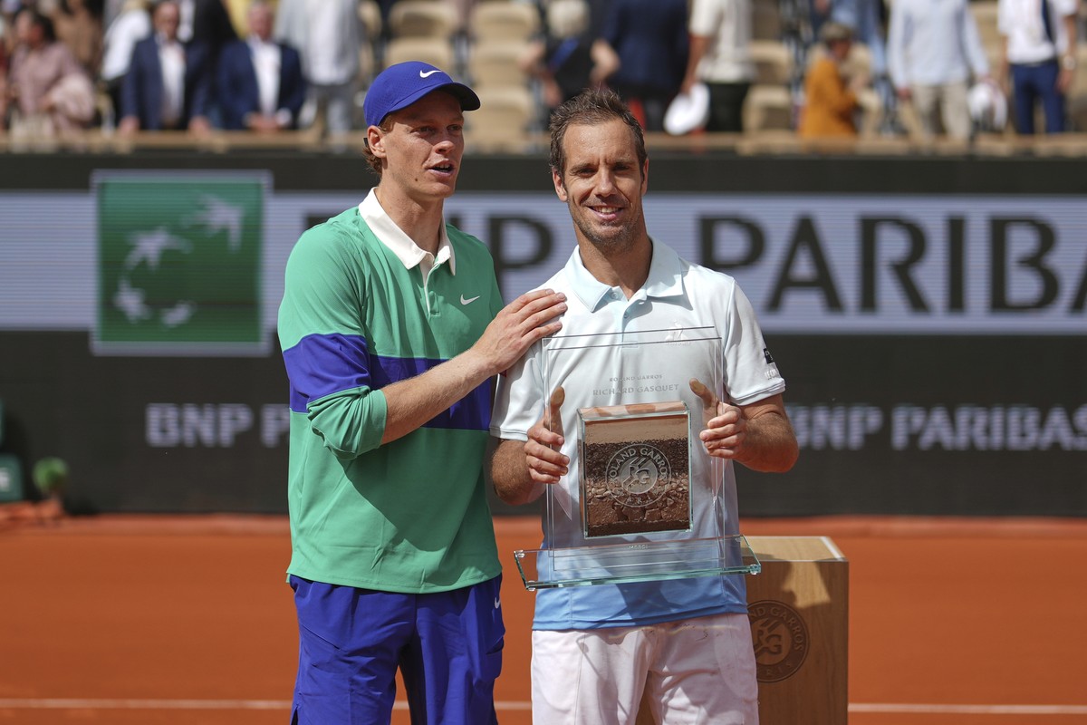 Italy's Jannik Sinner, left, stands by France's Richard Gasquet after their second round match of the French Tennis Open, at the Roland-Garros stadium, in Paris, Thursday, May 29, 2025. (AP  ...