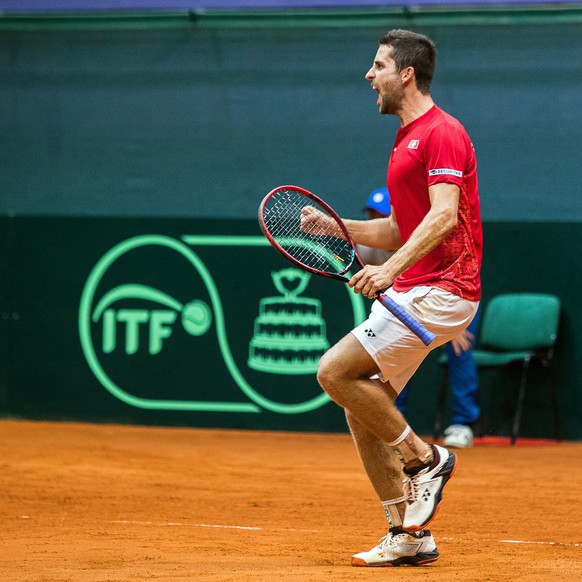 epa07840108 Sandro Ehrat of Switzerland celebrates after defeating Martin Klizan of Slovakia during the Davis Cup Europe/Africa Group I first round tie between Slovakia and Switzerland in Bratislava,  ...