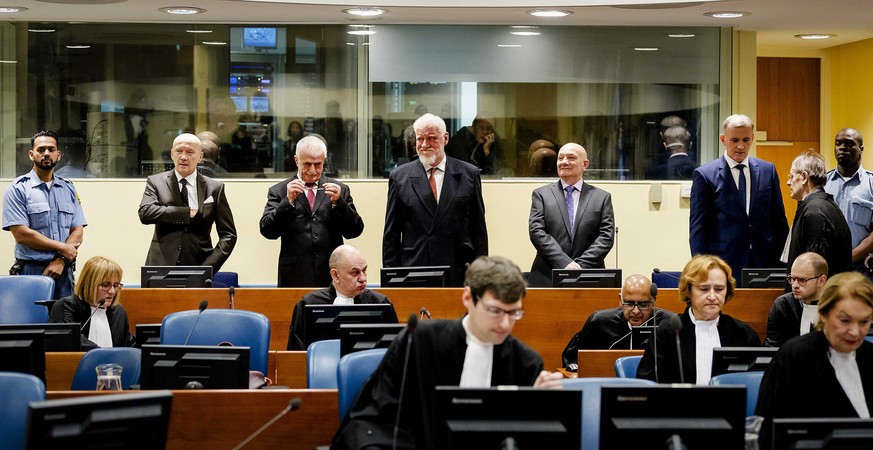 epa06357045 Jadranko Prlic (2-L) former Prime Minister of the Croatian Republic of Herzeg-Bosnia, and Bosnian Croats Bruno Stojic (3-L), Slobodan Praljak (4-L), Milivoj Petkovic (4-R), Valentin Coric  ...