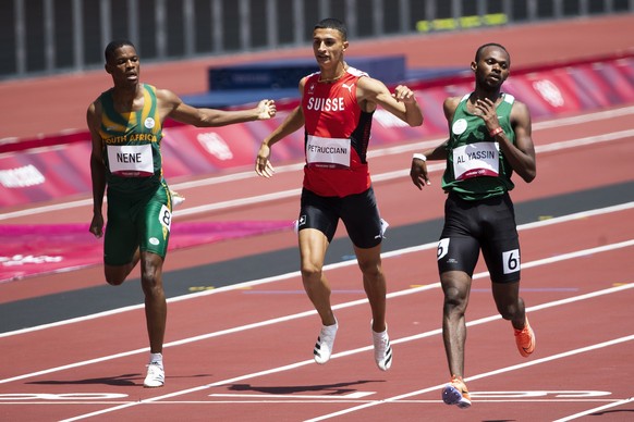 Ricky Petrucciani of Switzerland, center, Zakithi Nene of South Africa, left, and Mazen Moutan Al Yassin of Saudi Arabia, right, during the men&#039;s athletics 400m heat at the 2020 Tokyo Summer Olym ...