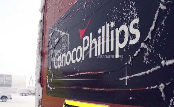 FILE - An ice-covered ConocoPhillips sign is displayed at the Colville-Delta 5, or as it&#039;s more commonly known, CD5, drilling site on Alaska&#039;s North Slope, Feb. 9, 2016. The Biden administra ...