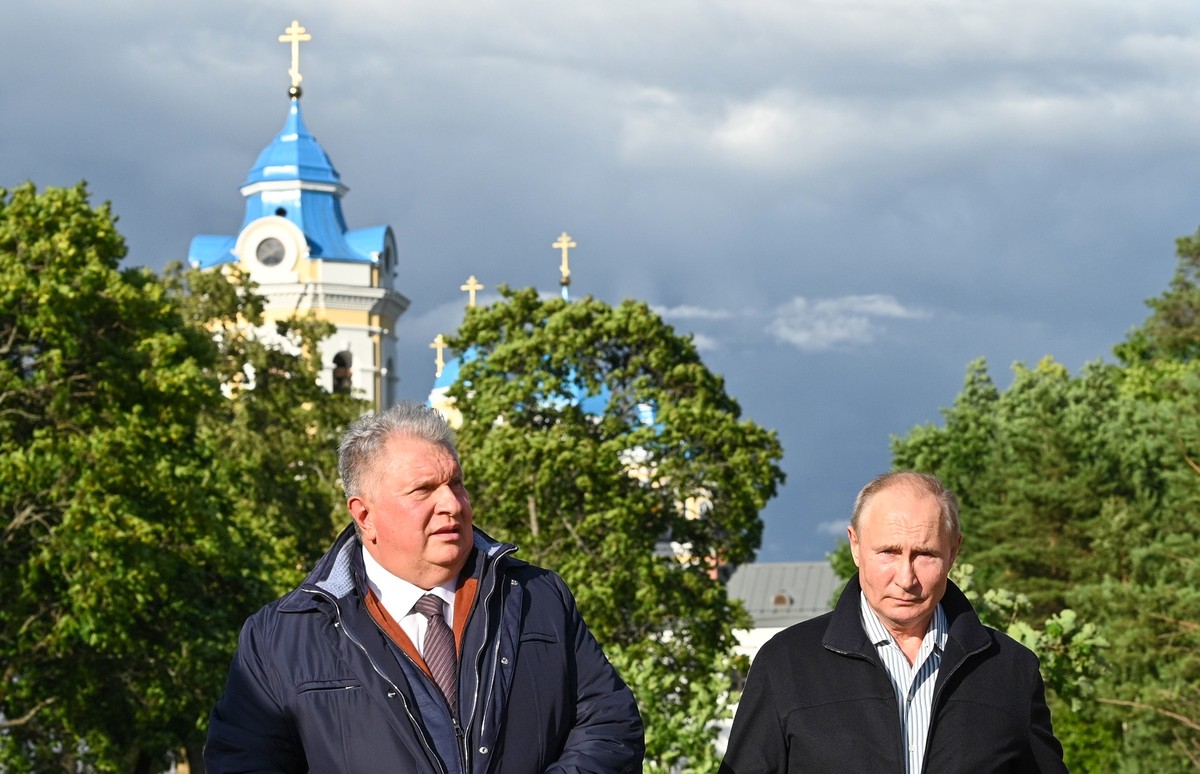 epa09385498 Russian President Vladimir Putin (R) and Russian 'Rosneft' Board Chairman Igor Sechin (L) visit the Konevsky Monastery on Konevets Island on Ladoga Lake in Leningrad region, 31 J ...