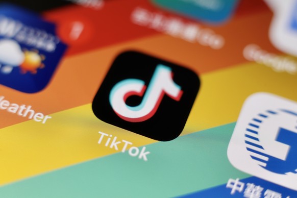 epa10351129 The Tiktok application logo is pictured on a smartphone in Taipei, Taiwan, 06 December 2022. On 02 December, the The US Federal Bureau of Investigation (FBI) warned about Tiktok, that it p ...