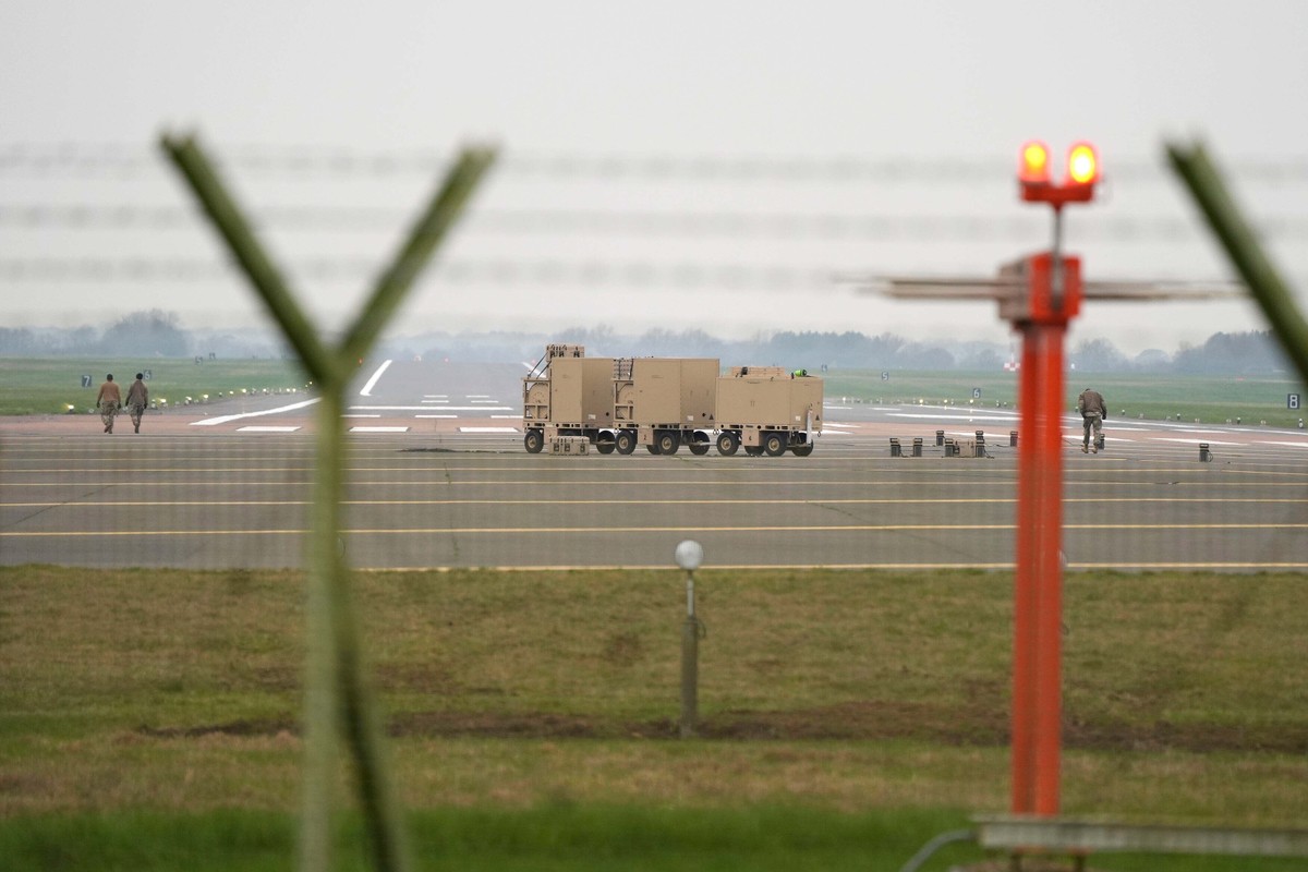 Military personnel walk on runway at RAF Fairford, England, Friday, March 6, 2026. (Andrew Matthews/PA via AP)
US and Israeli attacks on Iran