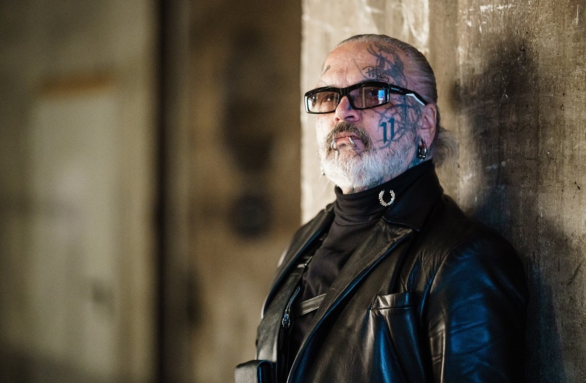 epa09827555 German photographer and doorman of Berlin's techno music club Berghain, Sven Marquardt poses for the photographer prior to a visit to the runway show of German designer Esther Perband ...