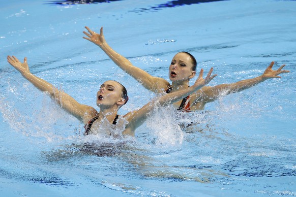 FILE - In this July 12, 2019, file photo, Rose Stackpole and Amie Thompson of Australia compete in the preliminaries of duet technical artistic swimming at the World Swimming Championships in Gwangju, ...