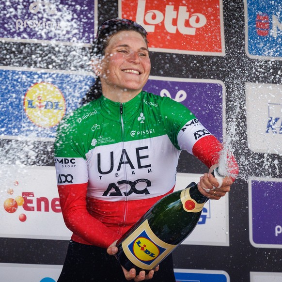 epa12039036 Winner Italian rider Elisa Longo Borghini of UAE Team ADQ celebrates on the podium after the Brabantse Pijl one-day cycling race for Elite Women over 125,7 from Lennik to Overijse, Belgium ...