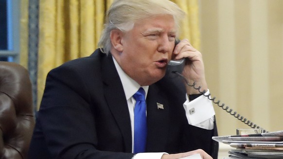 In this photo taken Jan. 28, 2017, President Donald Trump speaks on the phone with Australian Prime Minister Malcolm Turnbull in the Oval Office of the White House in Washington. Transcripts of Presid ...