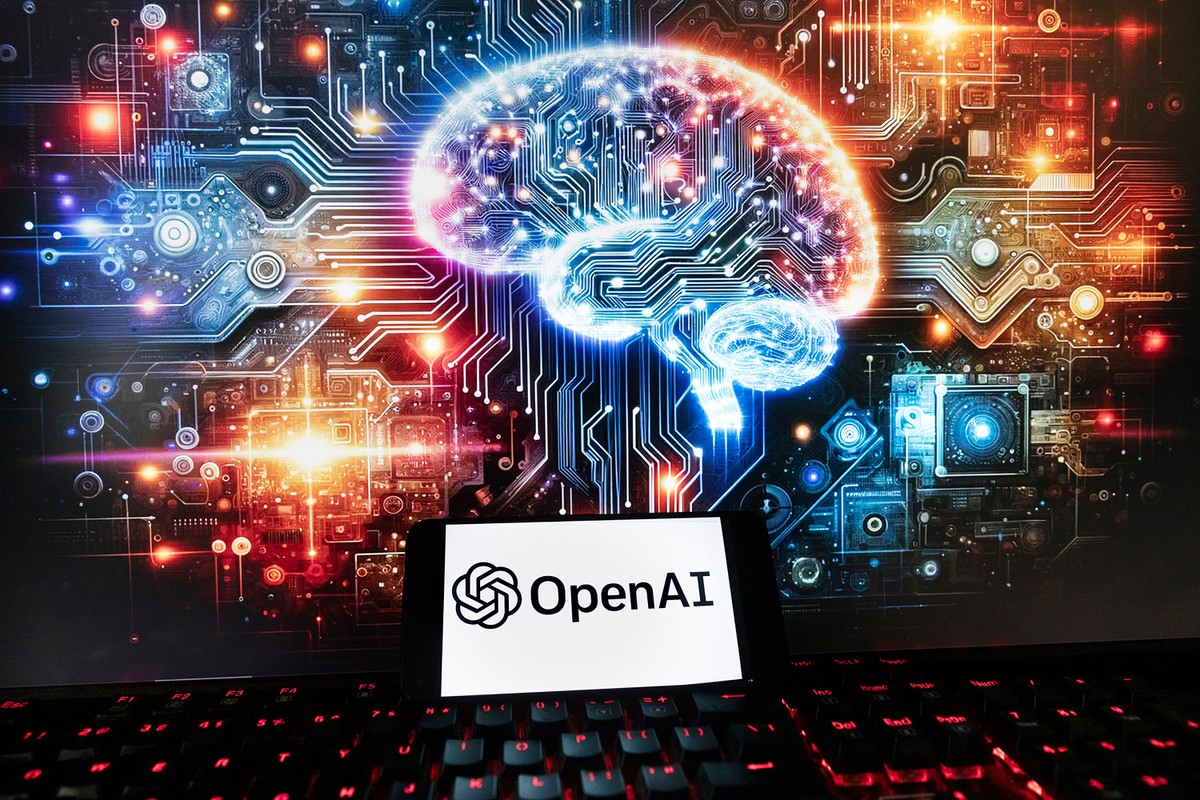 FILE - The OpenAI logo is displayed on a cell phone with an image on a computer monitor generated by ChatGPT's Dall-E text-to-image model, Friday, Dec. 8, 2023, in Boston. (AP Photo/Michael Dwyer ...