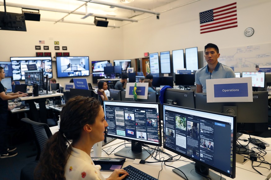 epa07101874 Lexi Sturdy (L), War Room Lead, and Charlie (an employee who elected not to give out his last name) (R) in the war room at Facebook in Menlo Park, California, USA, 17 October 2018 (issued  ...